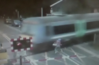Cyclist Has Close Call with Train