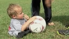 Boy without legs plays football